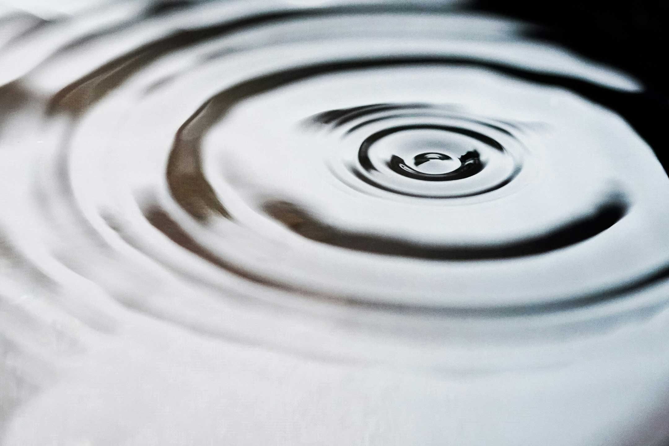 An evocative image of waves on the surface of water.