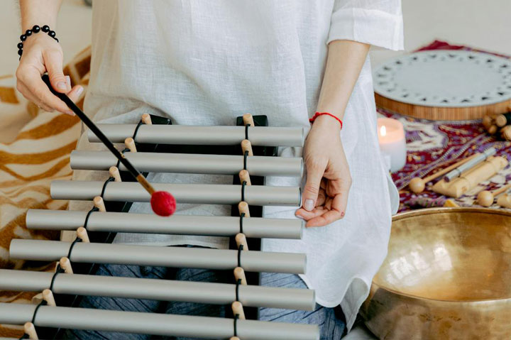 Sound-and-Neurodivergence-1 A person playing a small set of tubular bells