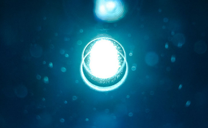 A light globe on a dark blue background